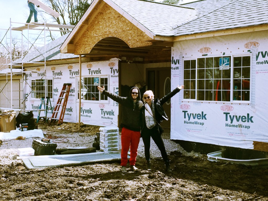 We Woke Up In This, In front of their new construction house.